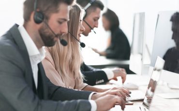 Call,Center,Operators,Using,Laptops,To,Work,With,Clients