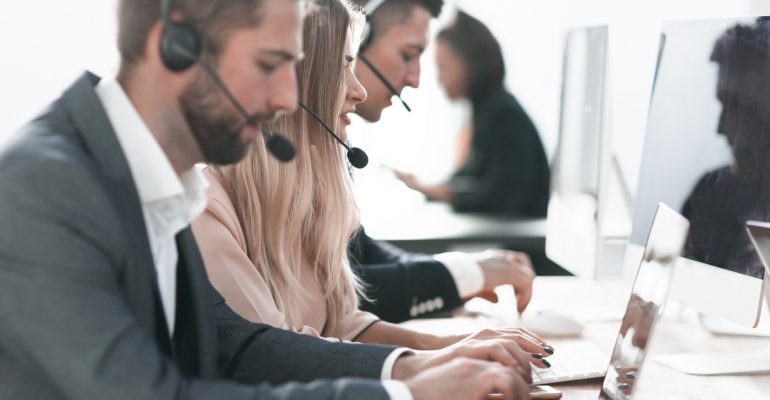 Call,Center,Operators,Using,Laptops,To,Work,With,Clients