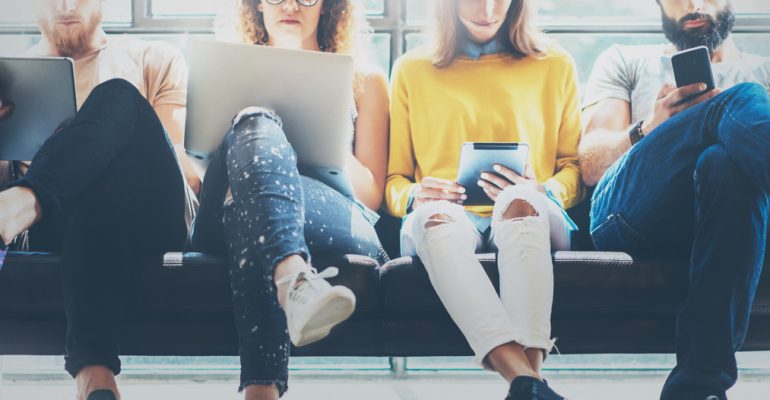 Group,Adult,Hipsters,Friends,Sitting,Sofa,Using,Modern,Gadgets.business,Startup