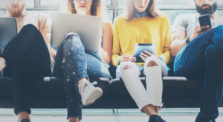 Group,Adult,Hipsters,Friends,Sitting,Sofa,Using,Modern,Gadgets.business,Startup