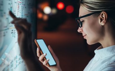 Interactive,Kiosk,With,Public,Transport,Subway,Map.female,Standing,At,Big